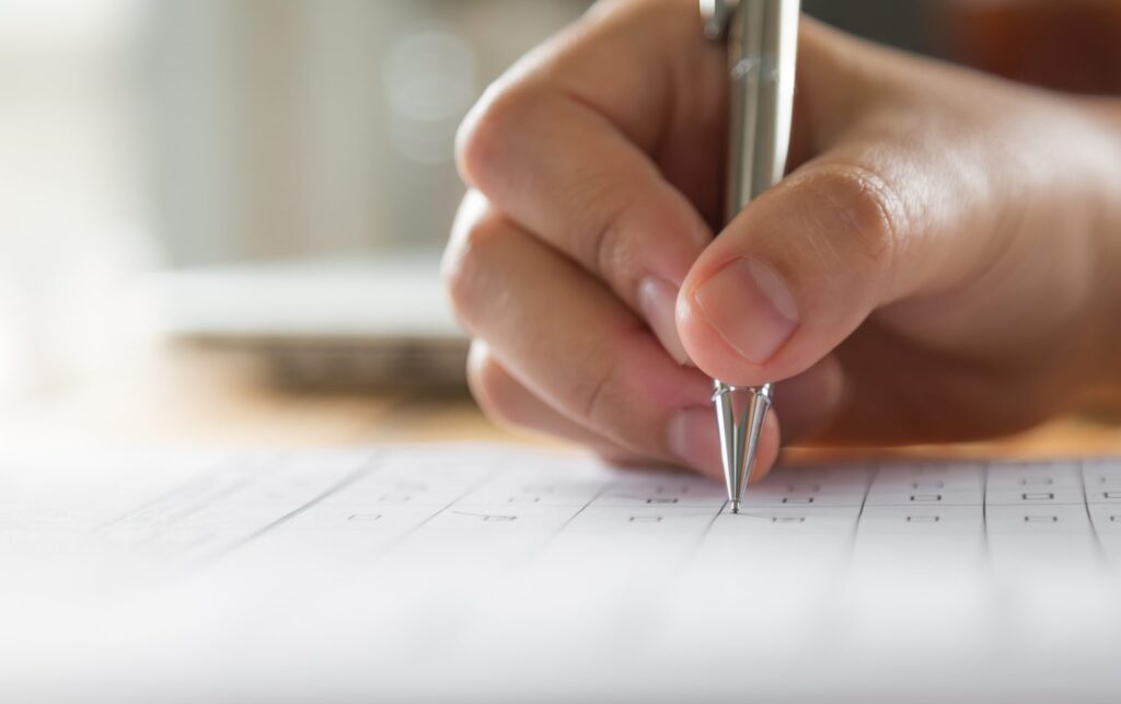 hand-writing-paper-with-pen-1-1536x964